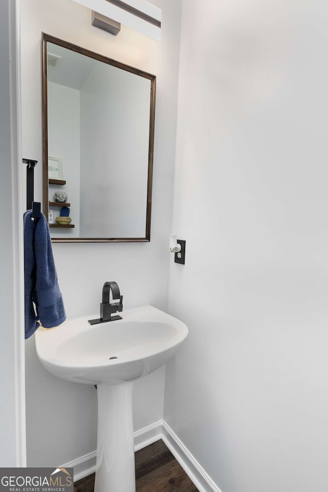 bathroom featuring hardwood / wood-style flooring