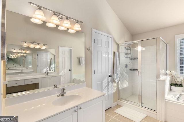 bathroom featuring vanity, shower with separate bathtub, and tile patterned floors