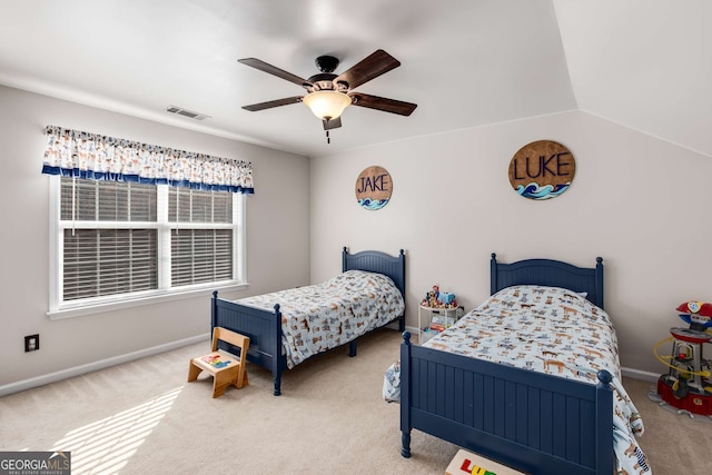 bedroom featuring ceiling fan, carpet flooring, and vaulted ceiling