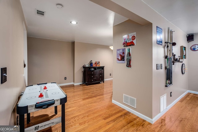 recreation room featuring light wood-type flooring