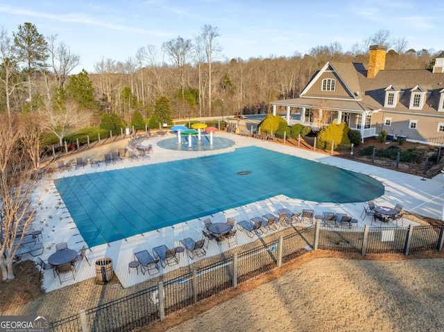 view of swimming pool with a patio area