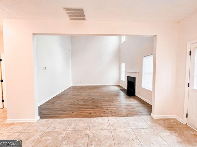 unfurnished living room featuring light hardwood / wood-style flooring