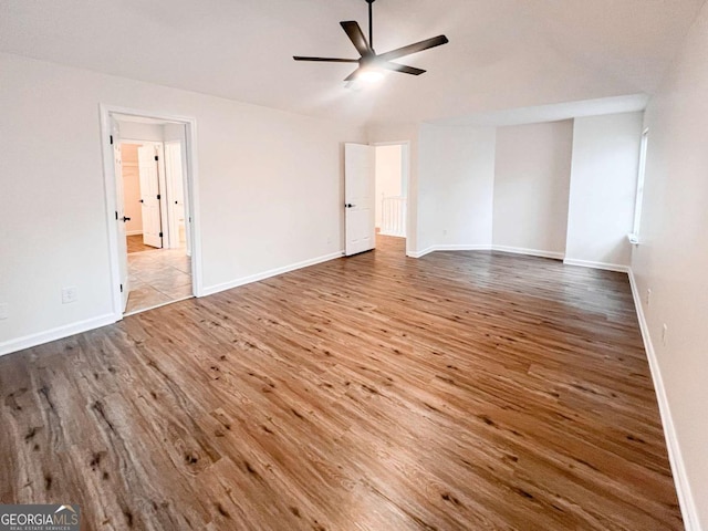 spare room with wood-type flooring and ceiling fan