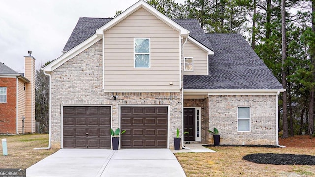 view of front of home with a garage