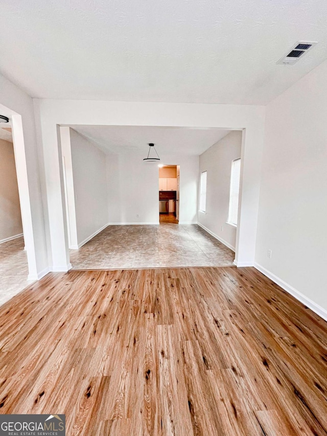 unfurnished living room with light wood-type flooring