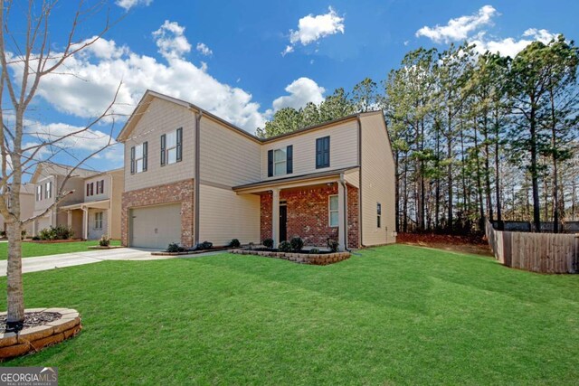 front of property with a garage and a front yard