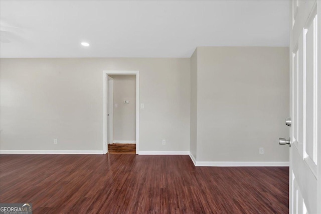 empty room featuring dark hardwood / wood-style floors