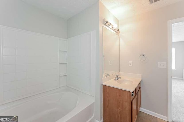 bathroom featuring tile patterned floors, vanity, and a wealth of natural light