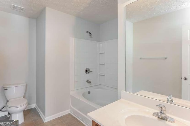 full bathroom with shower / bath combination, vanity, a textured ceiling, and toilet