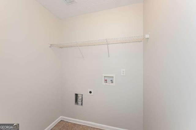 laundry room with hookup for a washing machine, a textured ceiling, and electric dryer hookup