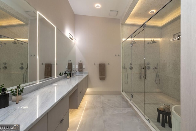 bathroom featuring an enclosed shower and vanity