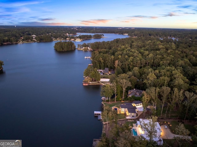 aerial view at dusk with a water view