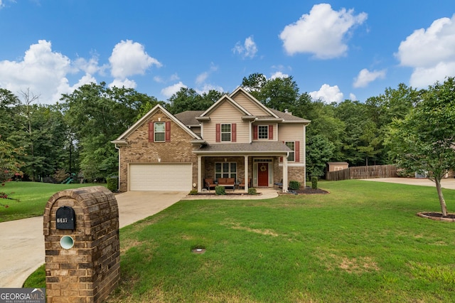 craftsman-style house featuring a garage, covered porch, and a front lawn