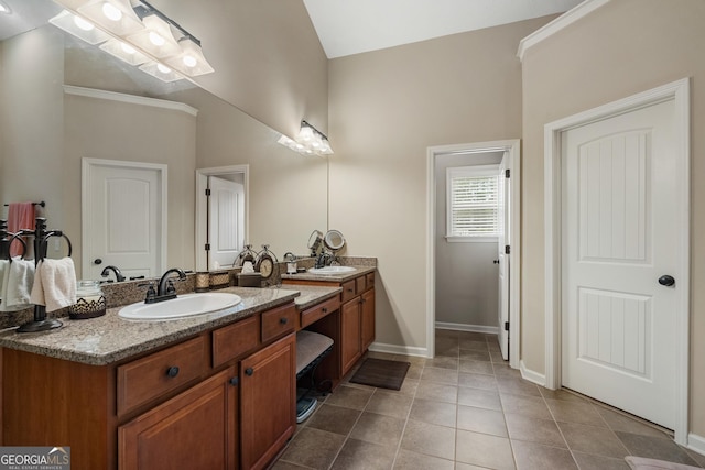 bathroom featuring tile patterned flooring and vanity