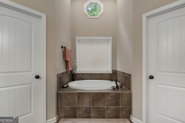 bathroom featuring tiled bath