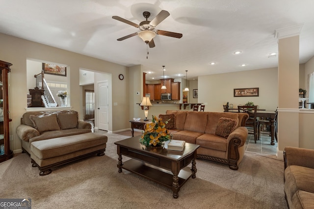 living room featuring light carpet and ceiling fan