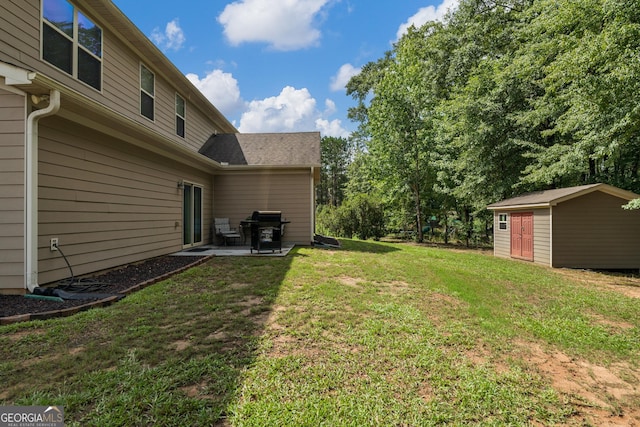 view of yard with a patio area and a storage unit