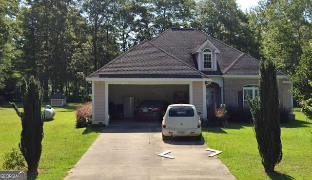 view of front of property with a garage and a front yard