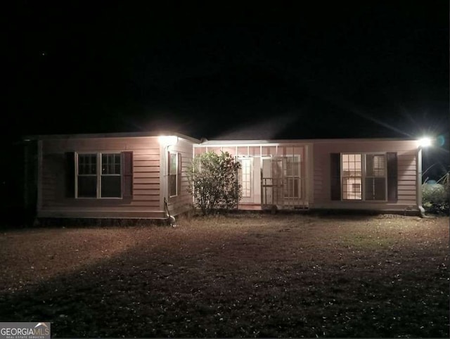 view of back house at night