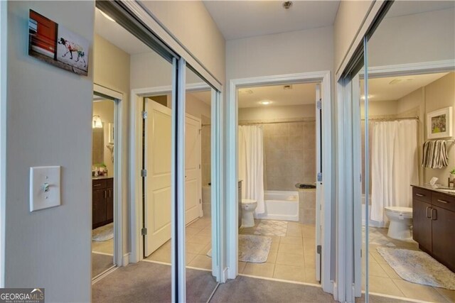 hallway featuring light tile patterned flooring