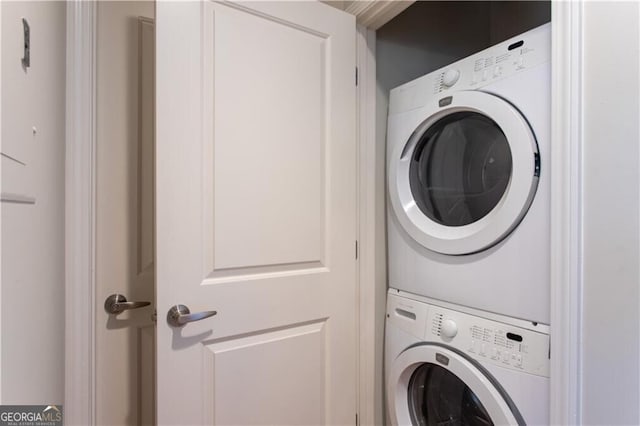 washroom with stacked washer and dryer