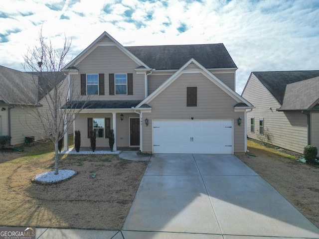 view of front of property with a garage and covered porch