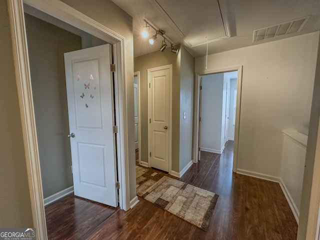 hall with dark hardwood / wood-style floors