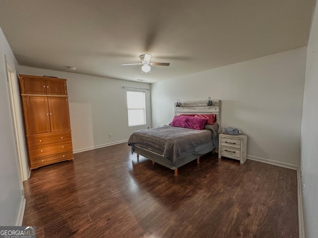 bedroom featuring ceiling fan and dark hardwood / wood-style floors