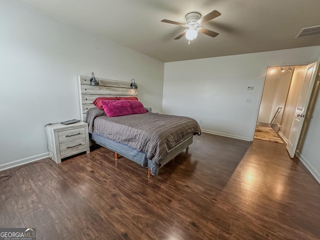 bedroom featuring dark hardwood / wood-style floors and ceiling fan