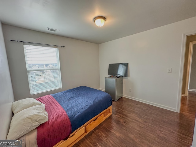 bedroom featuring dark wood-type flooring