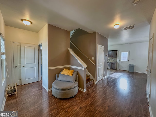 sitting room with dark hardwood / wood-style floors