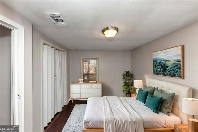 bedroom featuring dark hardwood / wood-style flooring