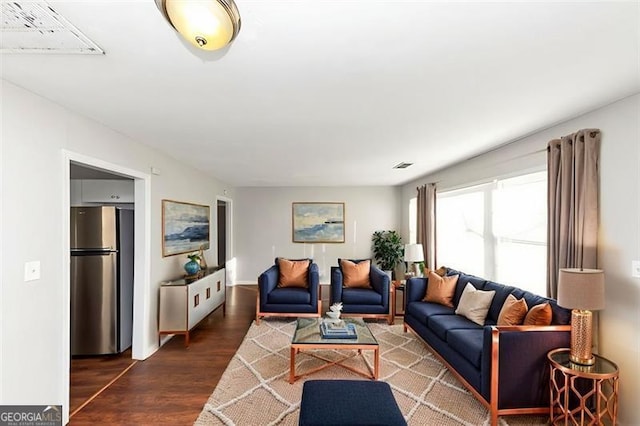 living room with dark hardwood / wood-style floors