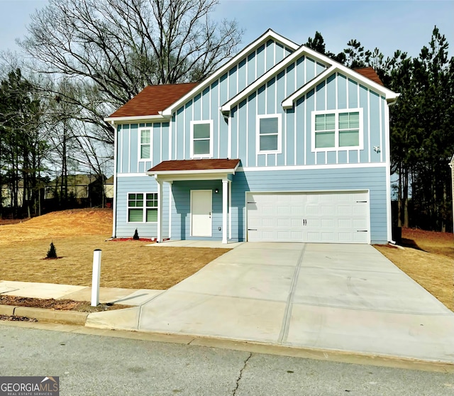 view of front of property with a garage