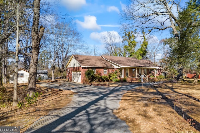 view of front of house with a garage and a porch