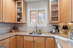 kitchen featuring tasteful backsplash and sink