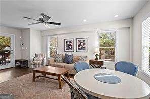 dining area featuring ceiling fan, hardwood / wood-style flooring, and a healthy amount of sunlight