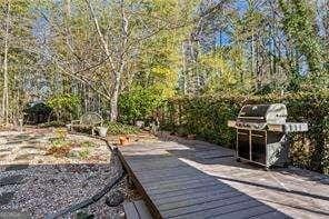 wooden terrace with area for grilling