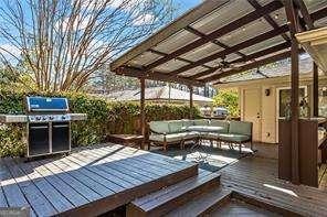 wooden deck with ceiling fan and an outdoor hangout area