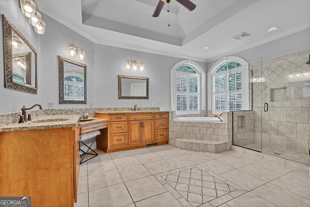 bathroom featuring ornamental molding, separate shower and tub, and a tray ceiling