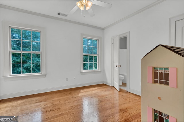 unfurnished room with crown molding, ceiling fan, and light hardwood / wood-style flooring