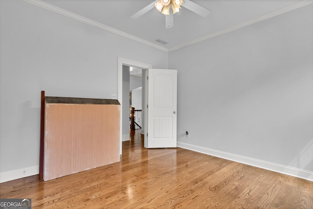 unfurnished bedroom featuring ornamental molding, light hardwood / wood-style floors, and ceiling fan