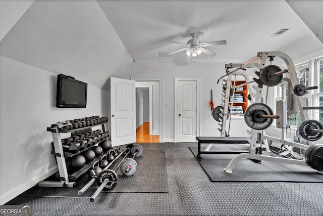 workout room featuring ceiling fan, ornamental molding, and lofted ceiling