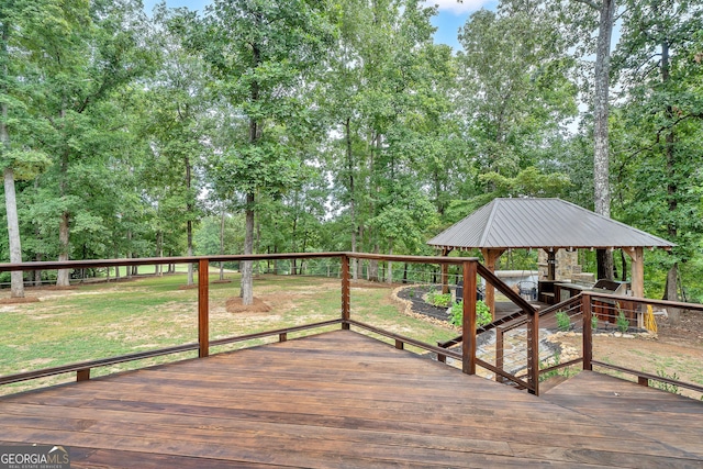 wooden deck with a gazebo and a lawn