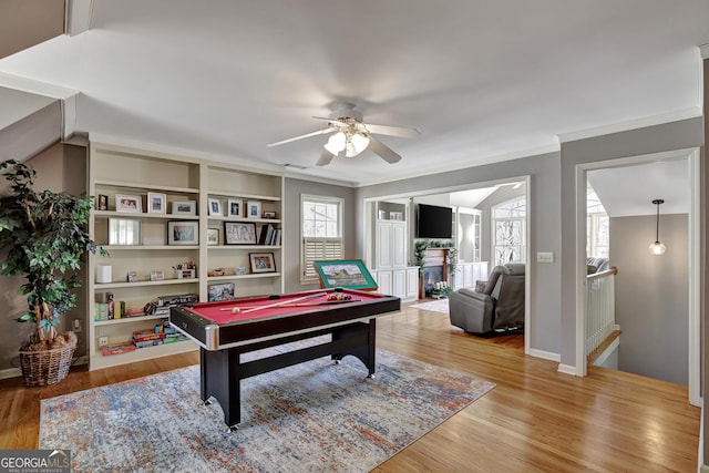 playroom with crown molding, pool table, ceiling fan, and light hardwood / wood-style flooring