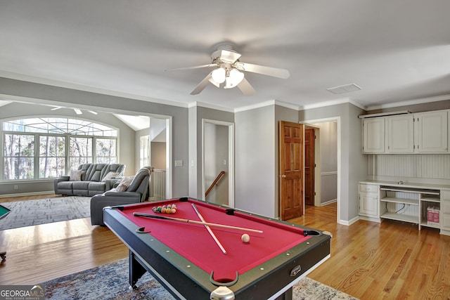 game room featuring light hardwood / wood-style flooring, ceiling fan, built in desk, ornamental molding, and pool table