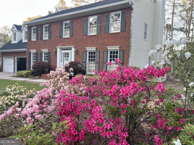 colonial home with a garage