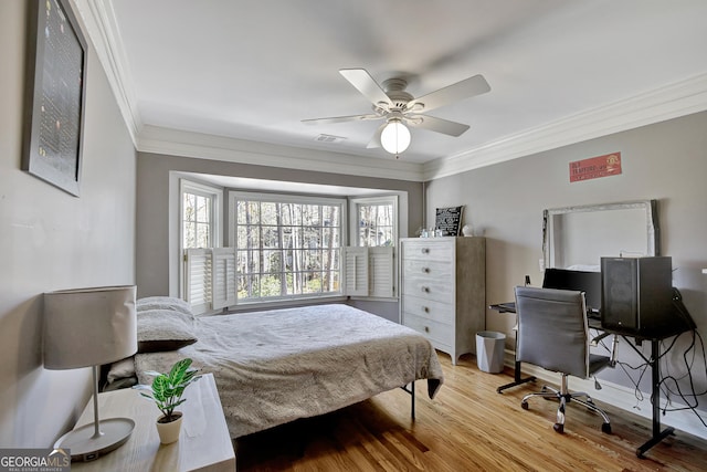 bedroom with crown molding, ceiling fan, and light wood-type flooring