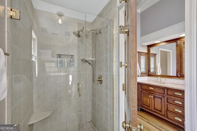 bathroom with vanity and an enclosed shower