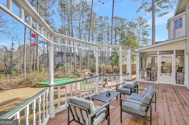 deck with a sunroom